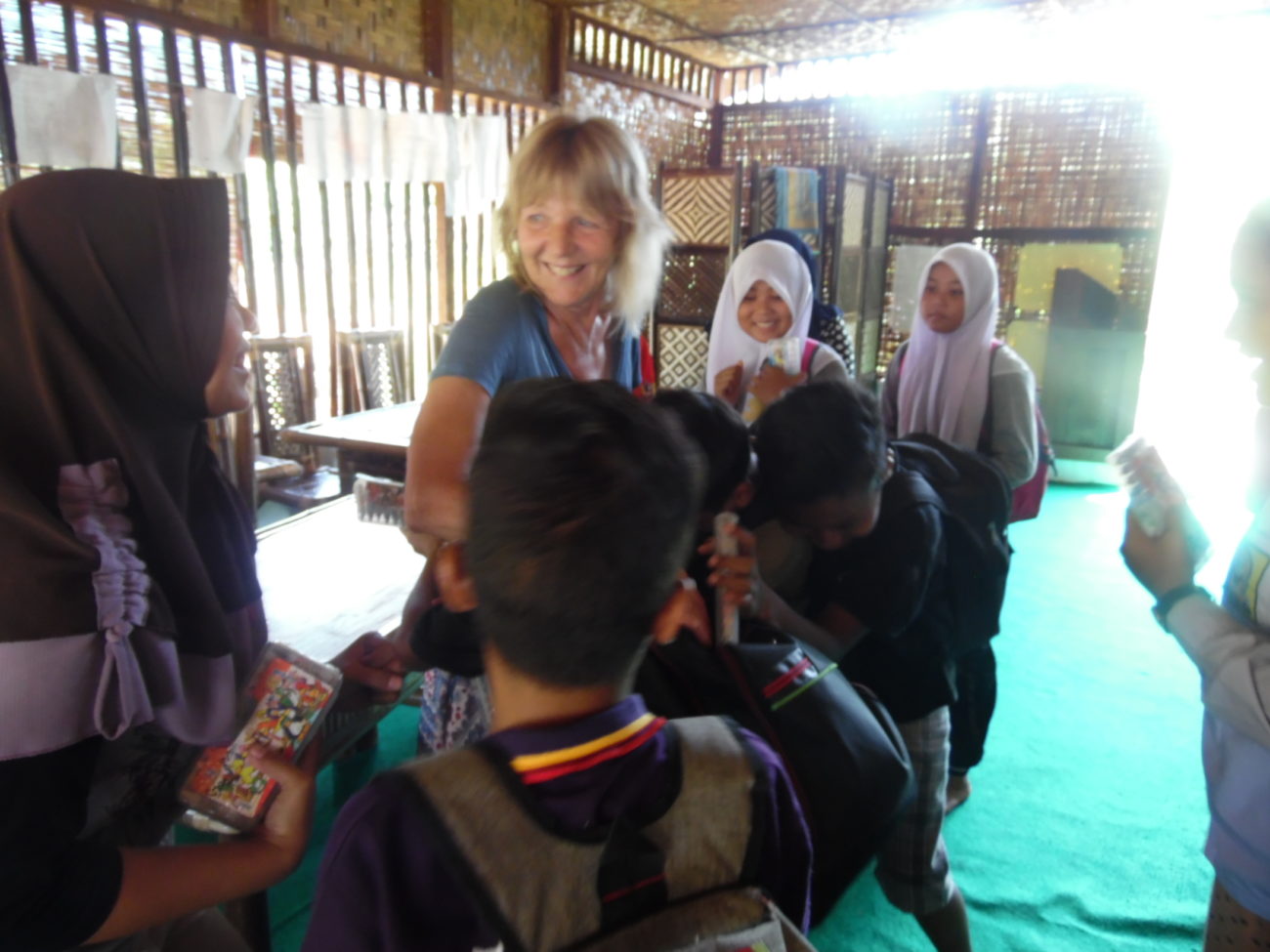 A teacher and pupils in a classroom in Sumatra.