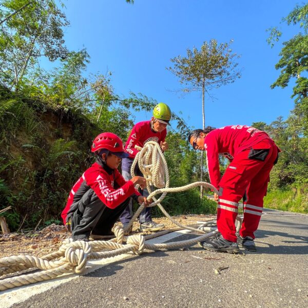 Members of Vertical Rescue Indonesia prepare ropes on the roadside