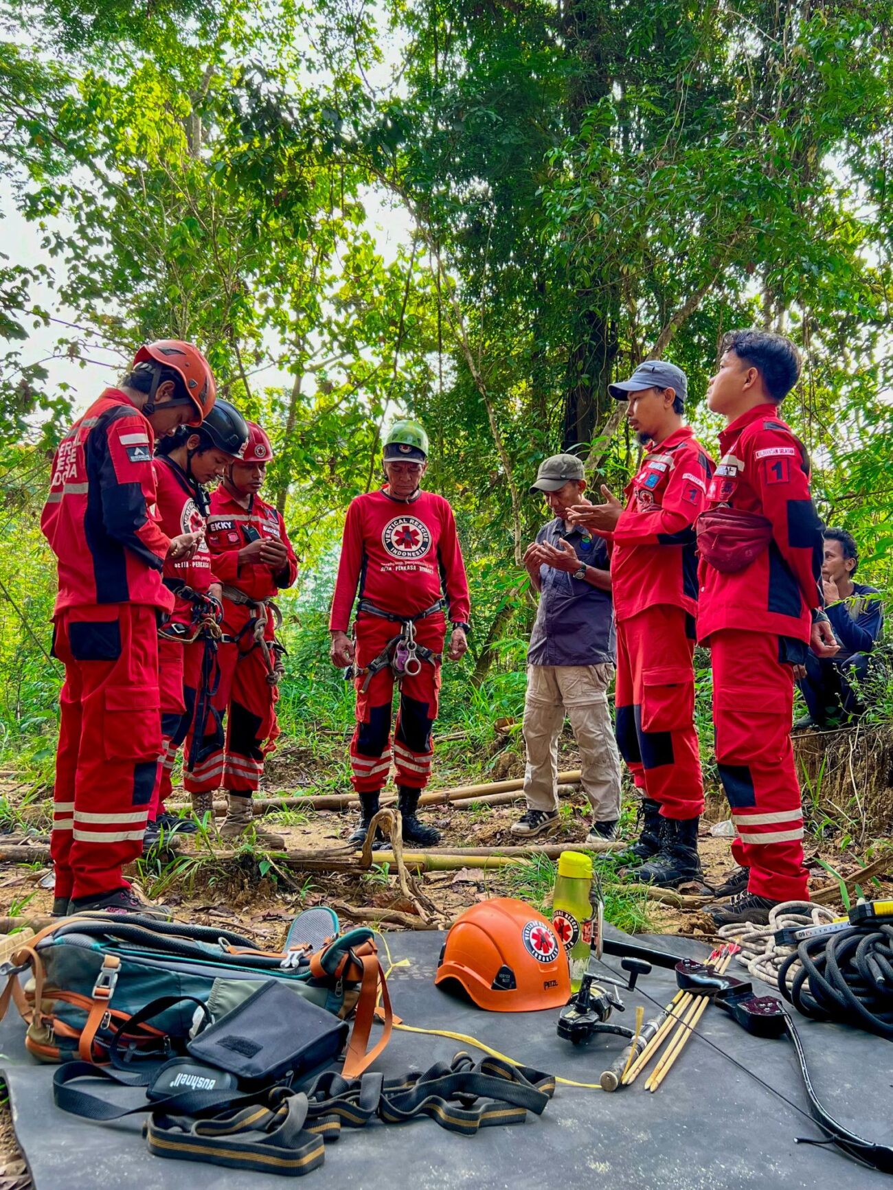 Members of the VRI team pray before starting work