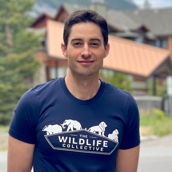 The wildlife photographer Zac Mills smiles and looks towards the camera