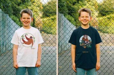 A child models two Sumatran Orangutan Society t-shirts, featuring orangutan illustrations.
