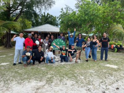 The TaHuKah team smile and wave at the camera