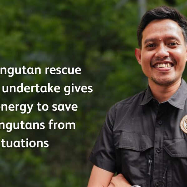 The image shows Krisna Ketapel wearing an OIC-branded shirt. The text reads: 